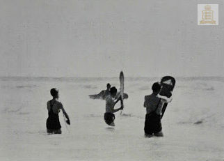 Students surfing in St Ouen's Bay