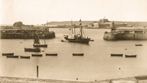 A paddle steamer enters the harbour