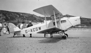 A DH83 Fox Moth on the beach at L'Etacq in the 1930s