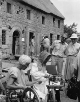Re-creation of a Jersey scene, complete with bonnets, at Hamptonne in 1990