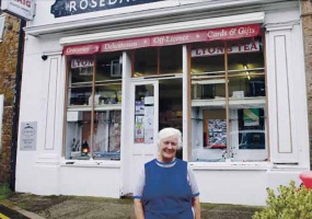 Pat Clarke in front of her shop in 2019