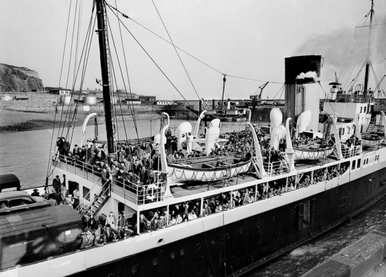 Seasonal farm workers arrive from France on the Brittany in 1959