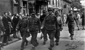 German prisoners walk to the Harbour under escort