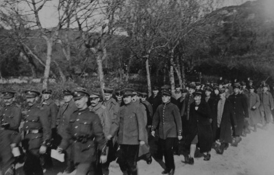 A procession of German prisoners of war marching from their camp in St Ouen’s Bay to St Brelade’s Churchyard in November 1918 to attend the funerals of three comrades.