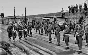 The colours of the Island Militia return to the island in 1946