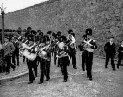 A garrison band marching down from Fort Regent