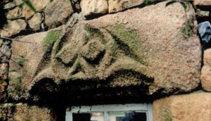 The chief feature from the ancient de la Rocque arms, here used rather as an English crest would have been used, in similar circumstances