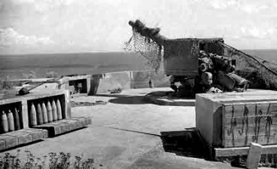 A clifftop gun defends St Aubin's Bay