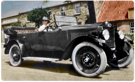 Frank Dobin in his American Moon car, a copy of a Rolls Royce, in front of Rosedale, Gorey Village in the 1920s. He ran a nearby garage