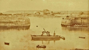 A dredger working in the harbour in the 1880s