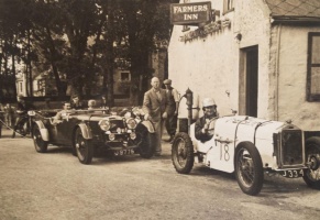 A post-war photograph outside the Farmers Inn in St Ouen, including an Aston Martin