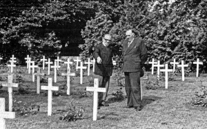 Rev Tabb and Constable John Chevalier in the cemetery. The german crosses have been replaced with white wooden ones