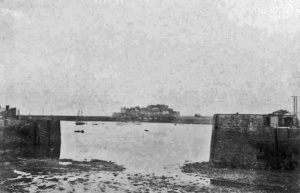 Time to bring in a dredger. The harbourmouth is completely dry in this 1890 photograph