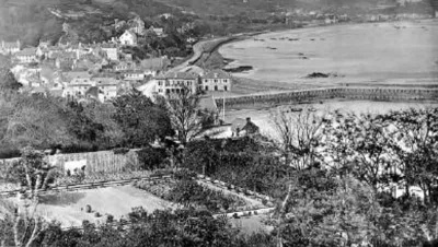 This photograph taken from the hill above St Aubin's Harbour shows in the top centre the start of work on the new seawall