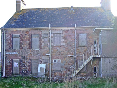 Sous L'Eglise, St Peter - de Gruchy farm (1849) by Croix ès Bruns, at the top of Jubilee Hill. Dated, initialled, stones are recorded. Demolished for Airport safety and rebuilt elsewhere