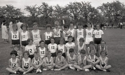 The school team won the Le Marquand Cup at Junior Country School Sports Day, June 1962. Team captains Heidi Langlois and Rob Shipley are holding the trophy