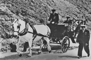 The Queen and Duke of Edinburgh enjoying a carriage ride on an official visit