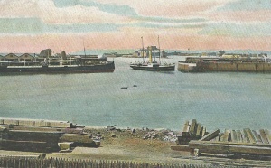 This early 20th century tinted photograph appears to show the sea wall under construction in the London Bay of Victoria Harbour