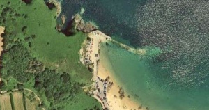A recent satellite view shows the remains of the pier and the rubble which still covers the beach along the full length of the original structure