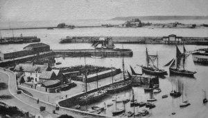 Sailing vessels pass the English Harbour