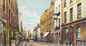 The western end of the street with the Mitre Hotel in the foreground