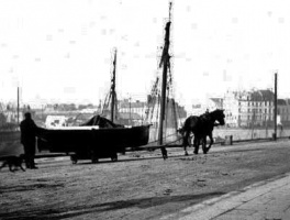 A P M Laurens photograph of a boat being moved along Commercial Buildings by a horse