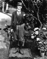 A portrait of George Remon in his garden