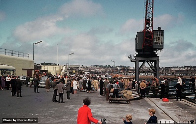 Passengers disembark from the Brittany