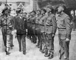 The King inspects a guard of honour of liberating soldiers in the Royal Square