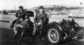 German soldiers with a commandeered car at St Helier Harbour