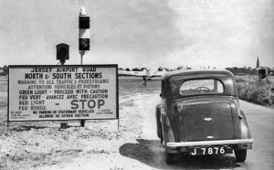 Traffic lights controlled traffic on a road which crossed the airfield