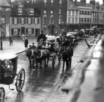 A funeral procession passes along the Parade in the early 20th century
