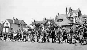 German prisoners of war march dejectedly towards their ejection from the island
