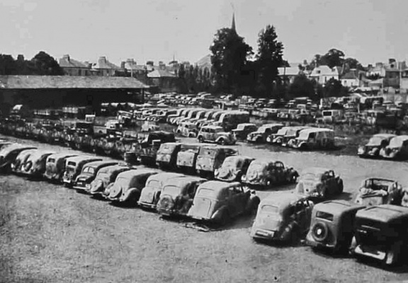 Our first consideration was transport. We had sailed with only a quarter of our transport requirements, and relied on captured vehicles to fill the gap. We took over all the German vehicles - approximately 500-600 of them - and issued out cars, lorries and motor cycles to the Force. A vehicle reception depot was established at Springfield Stadium. Here are a few of the vehicles, many civilian cars requisitioned by the Germans.