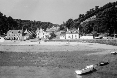 1955, and the large door has been replaced by a window, not an accurate match for the earlier window on the other side of the front door