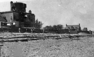 A poor quality photograph of German soldiers relaxing on the beach outside Le Hurel Tower at Grouville. It must have been taken by a German because no islander would have been allowed on the beach - certainly not in the open with a camera