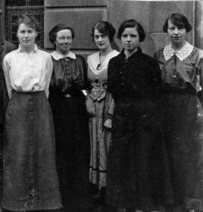 In September 1917 the States agreed to ration sugar, which had to be imported to the Island and was in short supply. They established a Sugar Controller, Major Lloyd, and appointed him a staff of lady clerks, some pictured here outside the Control Office in Hill Street.