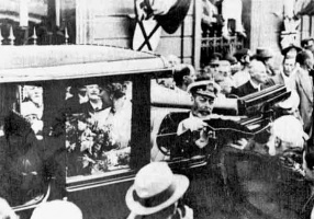 The King is presented with a replica Baton de Justice