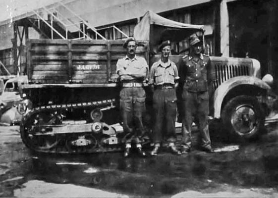 I opened a workshop, manned by German mechanics. They did the job very well indeed and maintained all the captured vehicles for us. One must give them credit for industry and thoroughness and they were very quiet and well behaved. Here is the senior German mechanic, Oberfeldwebel Georg Schulz, with myself and Corporal Arthur Teasdale