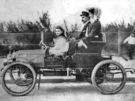 This car was built in Jersey in 1901 by George Pool, owner of Pool's Garage in Don Street. He is pictured on an outing with his wife and son, also George