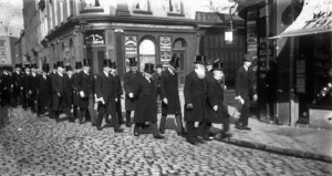 Members of the St Helier Municipality in procession along the street photographed by Percival Dunham