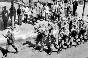 A German band marches through the streets of St Helier