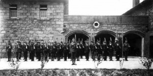 Militia recruits parade outside an arsenal