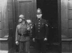A Jersey policeman outside the Town Hall with Germans