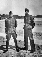 Two German soldiers pose for a snapshot at La Haule