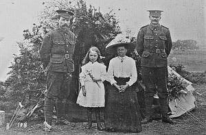 Family members were often welcomed at Militia camps. Were these two brothers, being visited by their mother and younger sister?