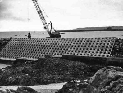 January 1974 - work continues on building the wall of cobs