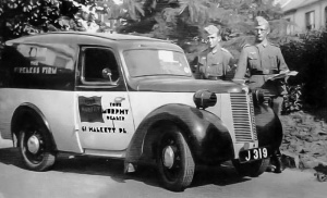 German soldiers taking an interest in W H Cole's van in the Occupation. The firm had a proud boast that it never did business with the Germans