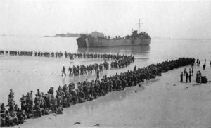 Lines of German prisoners wait to leave the island