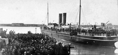 The SS Ibex pulls clear of the New North Quay after embarking the Contingent, bound for Weymouth. She was a Great Western Railways ship, one of several used on the England to Channel Islands route that were later impressed into military service. Always a popular vessel with Islanders, the Ibex returned after the war and remained in local service until 1925.